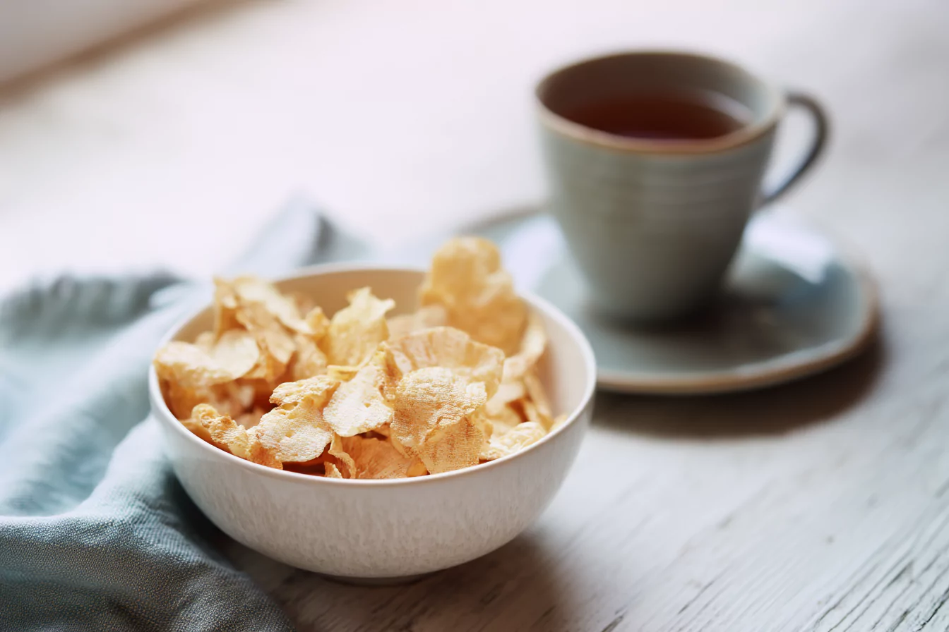 cottage-cheese-chip-conclusion Bowl of finished cottage cheese chips on cozy kitchen table