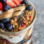Peanut butter Greek yogurt parfait with berries and chia seeds